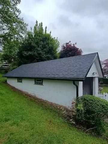 White outbuilding by KMA Carpentry