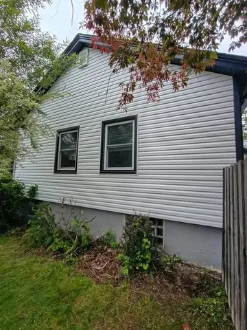 White siding and trim by KMA Carpentry